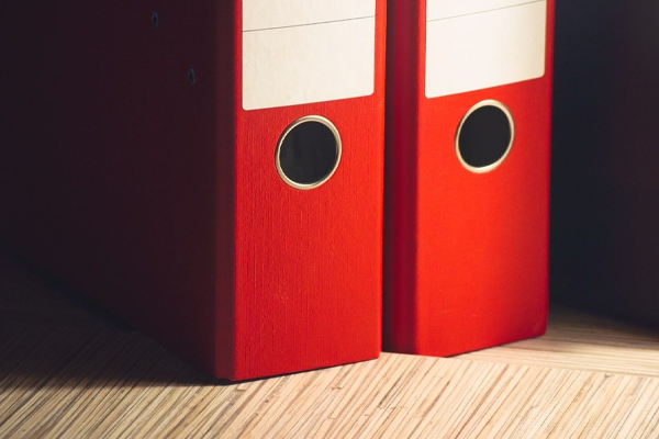 Two red binders