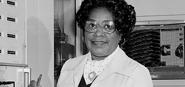 black and white photo of Mary W. Jackson holding a clipboard