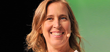 photo of Susan Wojcicki speaking into a headset